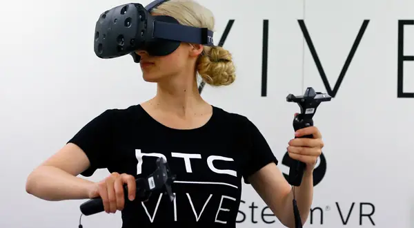 woman wearing htc vive virtual reality headset