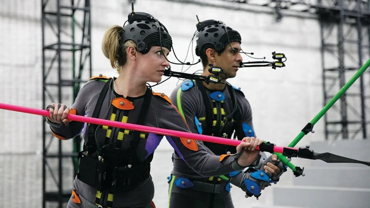 Two people using a motion capture suit