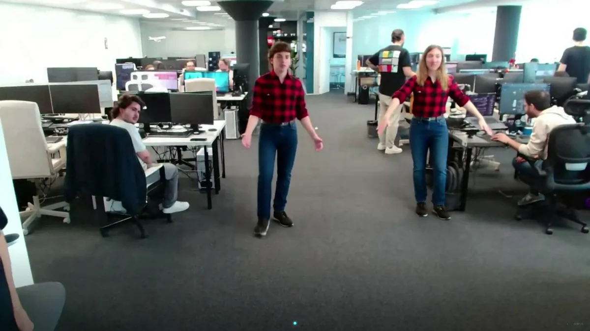 AI virtual try-on by FunMirror running in real time with two users wearing the same red checked shirt generated by AI
